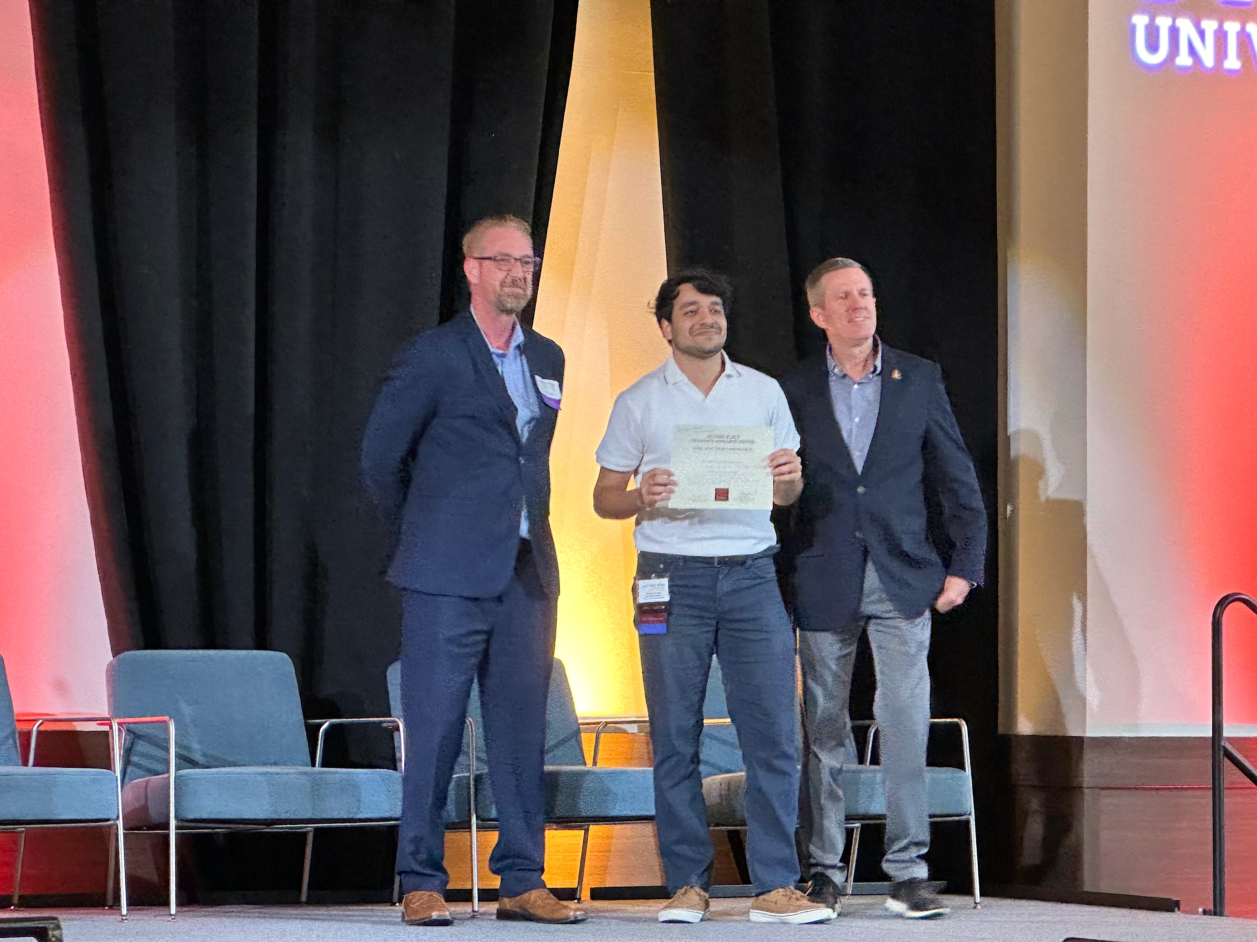 Farhaan receiving second place award at TXST STEM Conference 2026